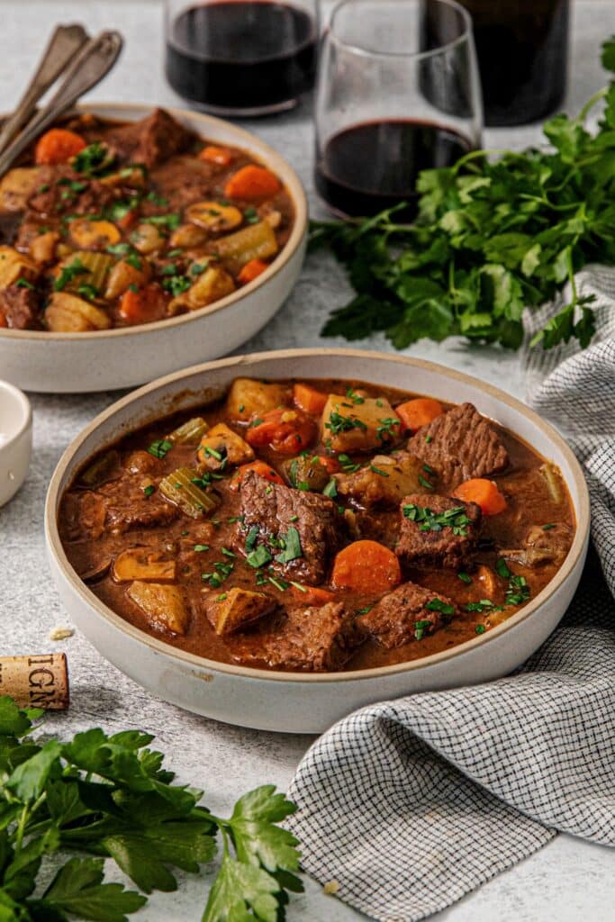 Two bowls of Dutch oven beef stew.