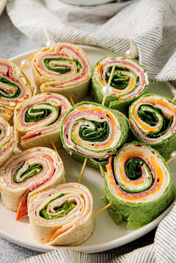 A party platter of pinwheel sandwiches.
