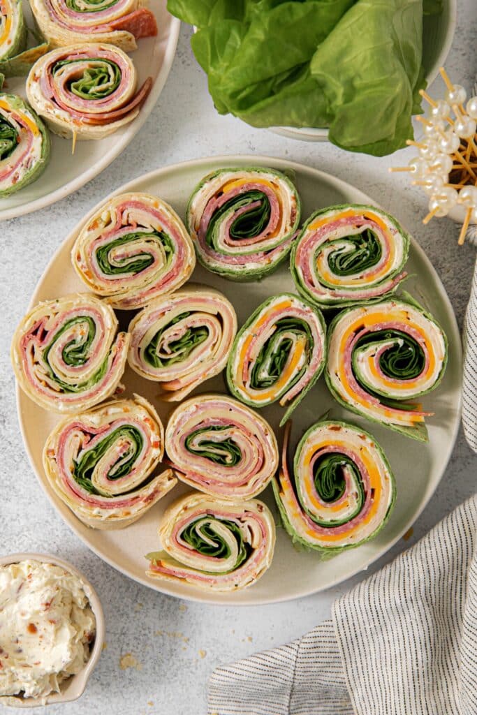 Pinwheel sandwiches on a serving plate.