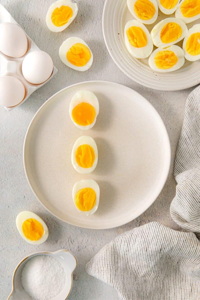Soft boiled eggs, halved and plated for breakfast.