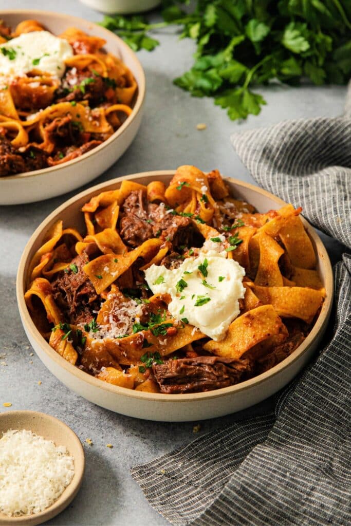 Short rib ragu with pappardelle and a scoop of ricotta cheese.